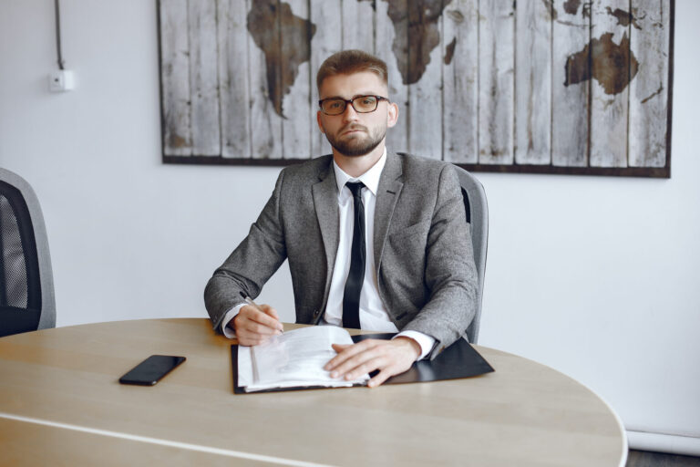 businessman working office man with glasses looks camera guy is sitting office